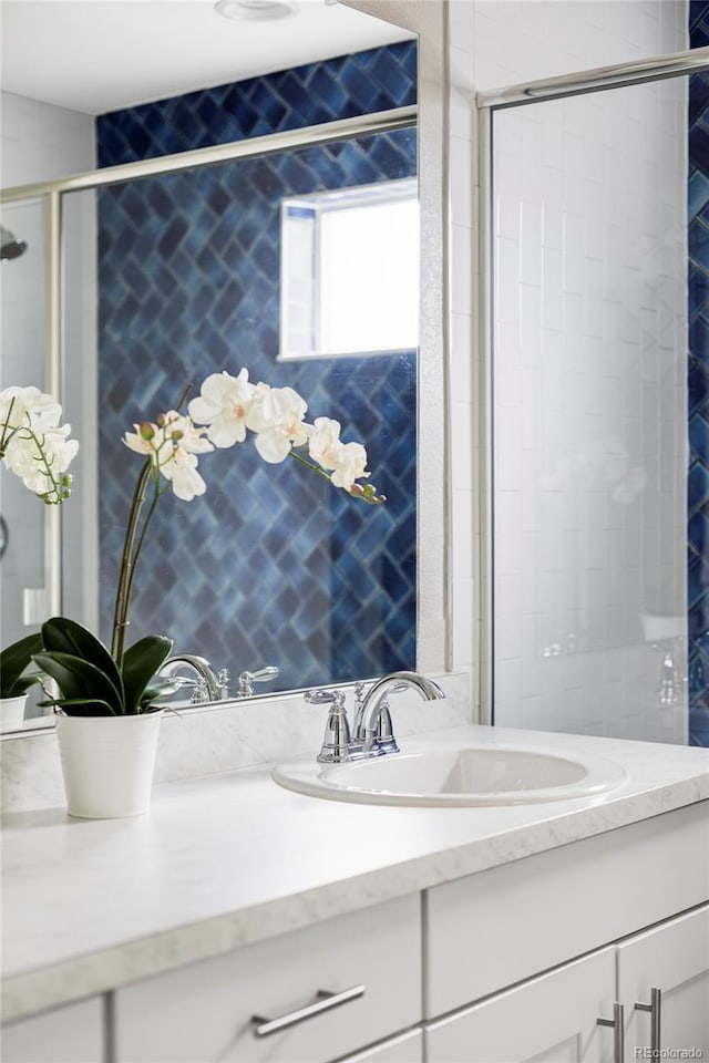 8917 Yates Dr, Westminster, CO 80031 - full bathroom with a tile shower and vanity