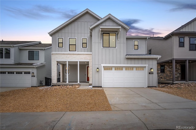 8850 Moonshimmer Trl, Littleton, CO 80125 - modern farmhouse style home with board and batten siding, an attached garage, concrete driveway, and a porch