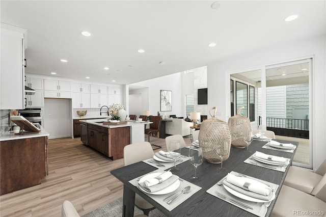 8850 Moonshimmer Trl, Littleton, CO 80125 - dining room featuring light wood-style flooring and recessed lighting