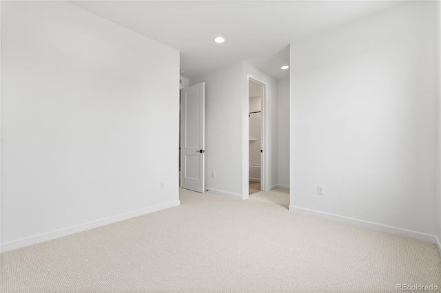 8850 Moonshimmer Trl, Littleton, CO 80125 - spare room with light carpet and recessed lighting