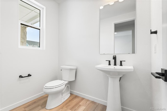 8850 Moonshimmer Trl, Littleton, CO 80125 - bathroom with baseboards and wood finished floors