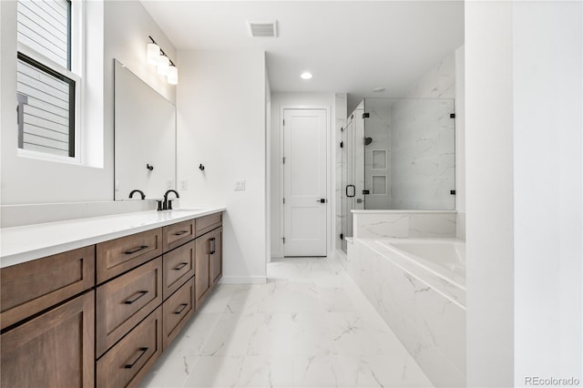 8850 Moonshimmer Trl, Littleton, CO 80125 - bathroom featuring marble look tile flooring, a bath, vanity, a marble finish shower, and recessed lighting