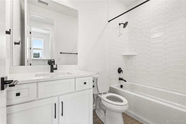 8850 Moonshimmer Trl, Littleton, CO 80125 - bathroom featuring vanity, shower / bathtub combination, and wood finished floors