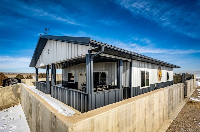 view of property exterior with covered porch