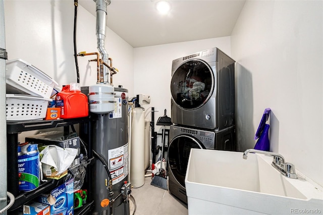 laundry room featuring sink, gas water heater, and stacked washing maching and dryer