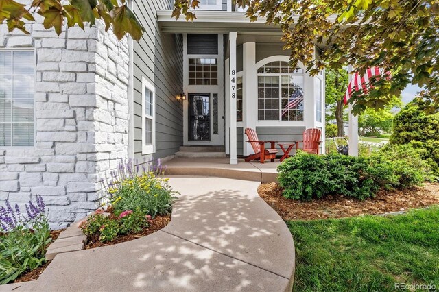 9478 Burgundy Cir, Highlands Ranch, CO 80126 - property entrance featuring a porch