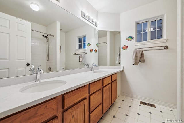 9478 Burgundy Cir, Highlands Ranch, CO 80126 - full bathroom featuring double vanity and baseboards