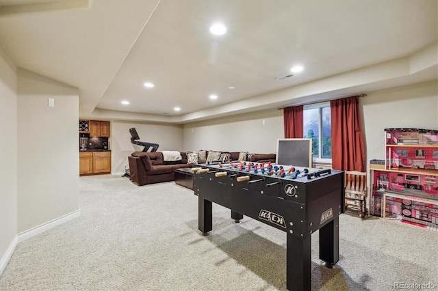 9478 Burgundy Cir, Highlands Ranch, CO 80126 - playroom with light colored carpet, recessed lighting, and a raised ceiling