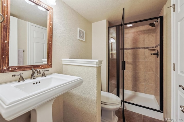 9478 Burgundy Cir, Highlands Ranch, CO 80126 - full bathroom with a textured wall, a shower stall, and a textured ceiling