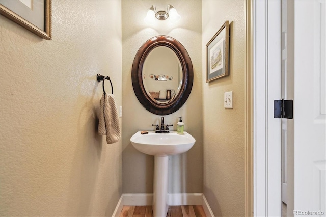 9478 Burgundy Cir, Highlands Ranch, CO 80126 - bathroom featuring wood finished floors and a textured wall
