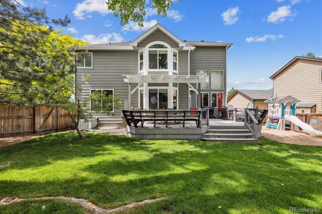9478 Burgundy Cir, Highlands Ranch, CO 80126 - rear view of property with a fenced backyard, a pergola, a deck, and a playground