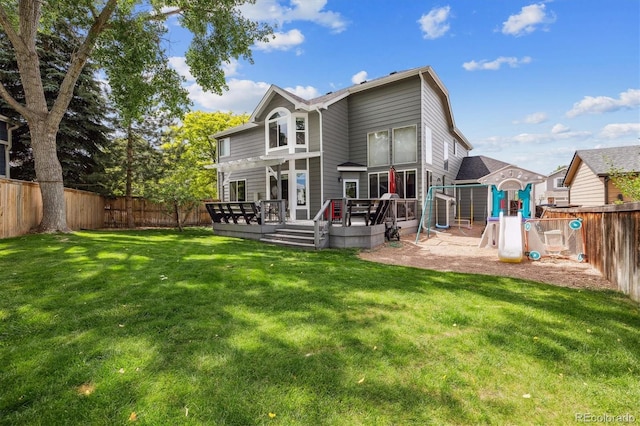 9478 Burgundy Cir, Highlands Ranch, CO 80126 - rear view of property with a fenced backyard, a wooden deck, and a playground