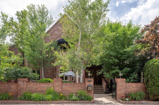 2409 E Cedar Ave, Denver, CO 80209 - obstructed view of property with brick siding