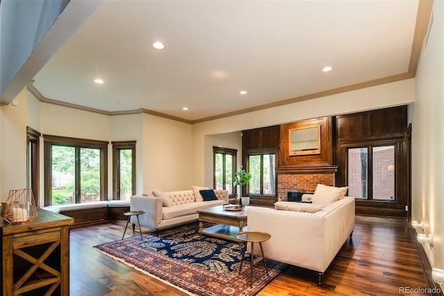2409 E Cedar Ave, Denver, CO 80209 - living area with dark wood-type flooring, recessed lighting, crown molding, and a brick fireplace