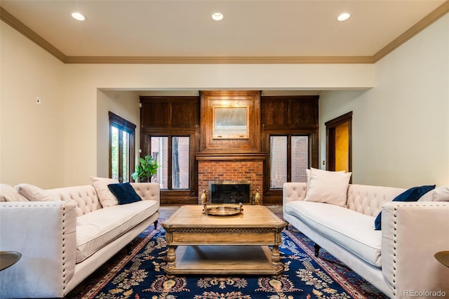 2409 E Cedar Ave, Denver, CO 80209 - living room featuring crown molding, recessed lighting, a fireplace, and wood finished floors