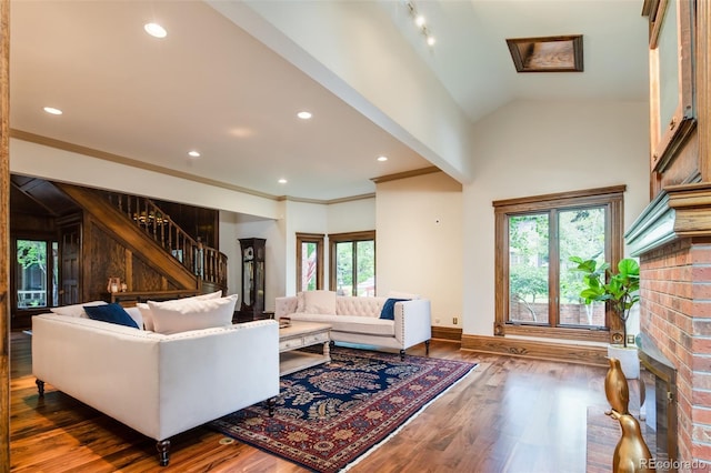 2409 E Cedar Ave, Denver, CO 80209 - living room featuring stairs, wood finished floors, recessed lighting, and ornamental molding