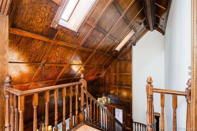 2409 E Cedar Ave, Denver, CO 80209 - stairway featuring vaulted ceiling and wood walls