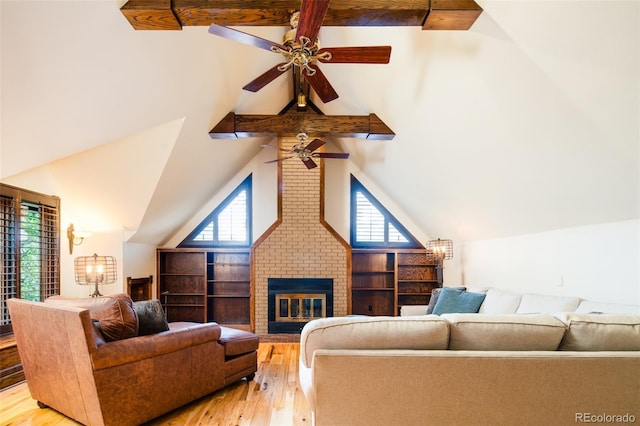 2409 E Cedar Ave, Denver, CO 80209 - living room featuring high vaulted ceiling, ceiling fan, light wood-type flooring, a fireplace, and beamed ceiling