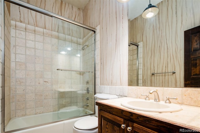 2409 E Cedar Ave, Denver, CO 80209 - bathroom featuring vanity and combined bath / shower with glass door