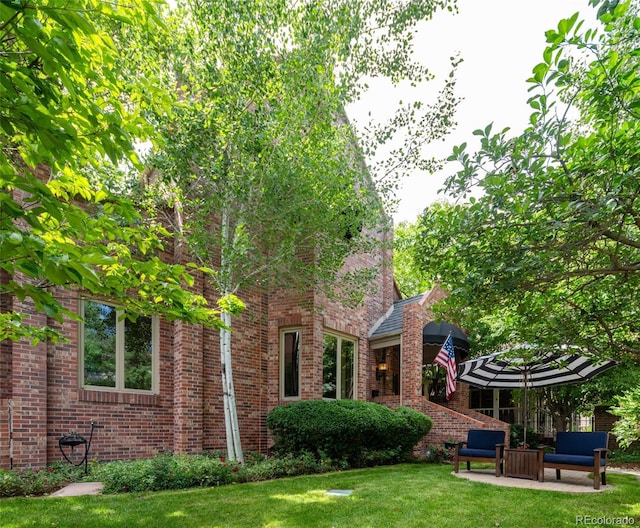 2409 E Cedar Ave, Denver, CO 80209 - view of grassy yard with a patio area
