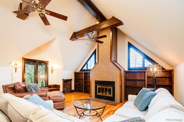 2409 E Cedar Ave, Denver, CO 80209 - living area featuring a fireplace, ceiling fan, high vaulted ceiling, beamed ceiling, and wood finished floors