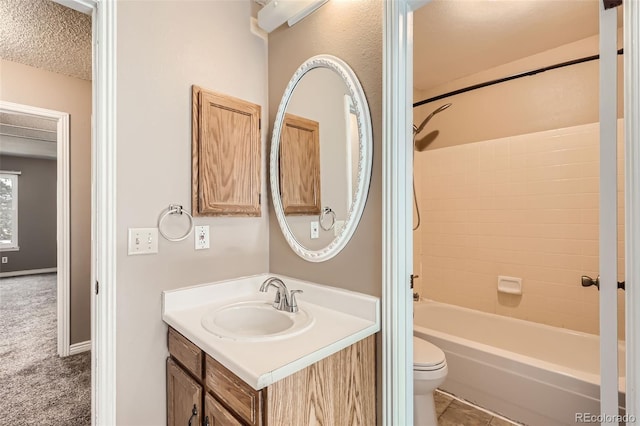 full bathroom featuring vanity, toilet, shower / bathtub combination, and a textured ceiling