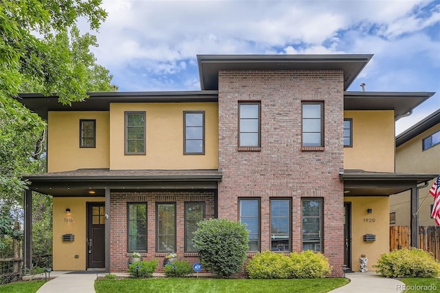 1916 S Elati St, Denver, CO 80223 - view of front facade with brick siding and stucco siding