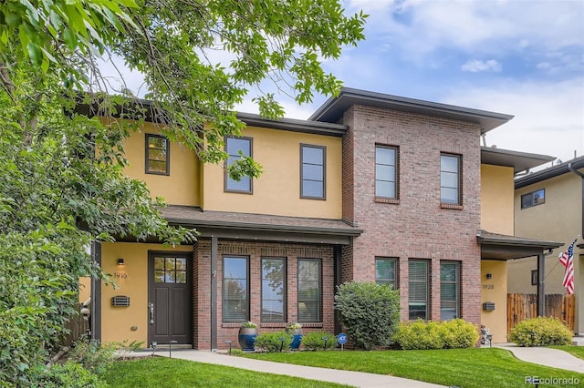 1916 S Elati St, Denver, CO 80223 - view of front of house featuring brick siding and stucco siding