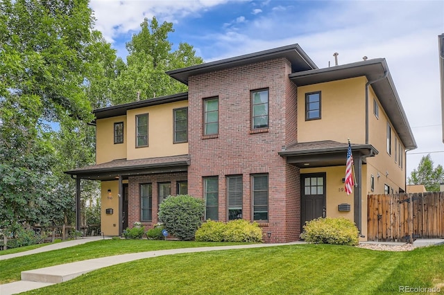 1916 S Elati St, Denver, CO 80223 - view of front of house featuring stucco siding and brick siding