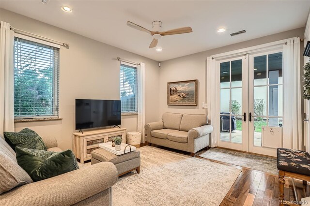 1916 S Elati St, Denver, CO 80223 - living area with hardwood / wood-style flooring, plenty of natural light, french doors, a ceiling fan, and recessed lighting