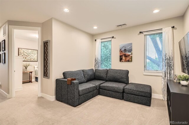 1916 S Elati St, Denver, CO 80223 - living area featuring light carpet, healthy amount of natural light, and recessed lighting