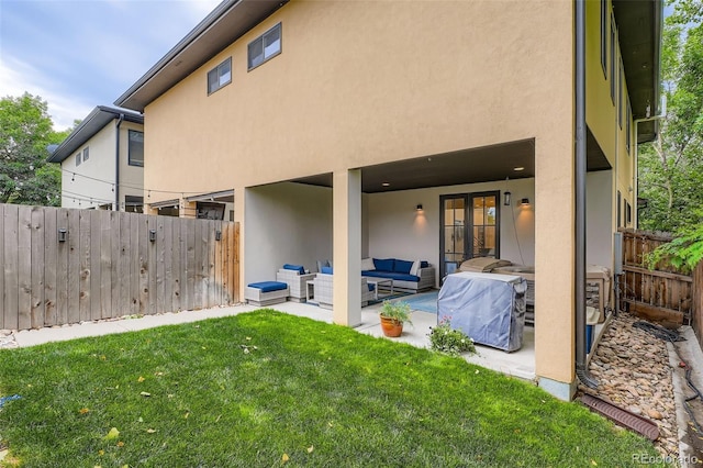 1916 S Elati St, Denver, CO 80223 - back of property featuring outdoor lounge area, a patio, and stucco siding