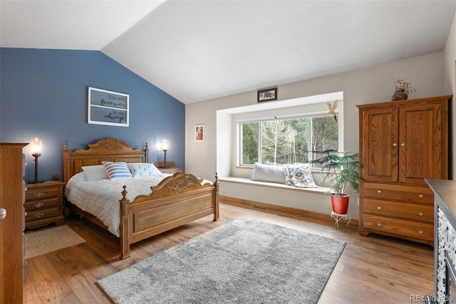 2230 County Road 72, Bailey, CO 80421 - bedroom featuring vaulted ceiling, light wood-style floors, and baseboards