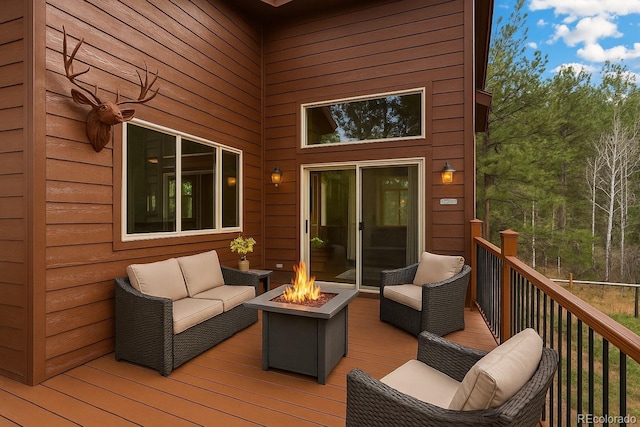 2230 County Road 72, Bailey, CO 80421 - wooden deck featuring an outdoor living space with a fire pit