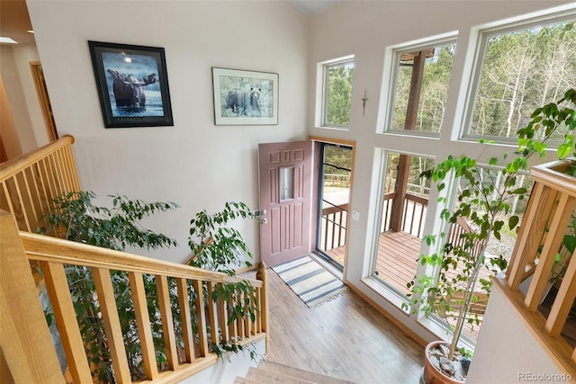 2230 County Road 72, Bailey, CO 80421 - entrance foyer with healthy amount of natural light, wood finished floors, and stairway