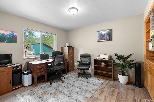 2230 County Road 72, Bailey, CO 80421 - office area with light wood finished floors