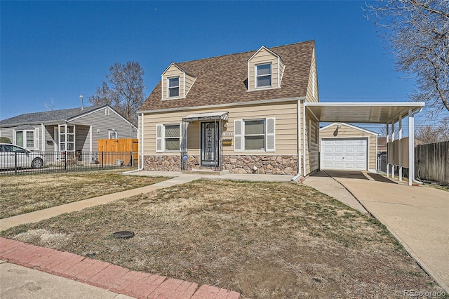 view of front of property with stone siding, driveway, a garage, and fence