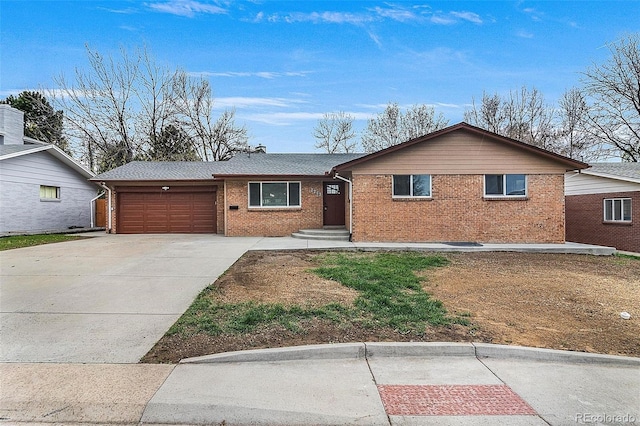 ranch-style home with brick siding, a garage, and concrete driveway
