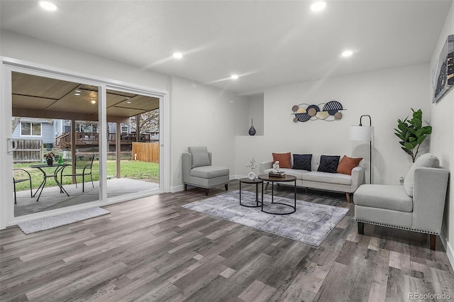 living room with baseboards, recessed lighting, and wood finished floors