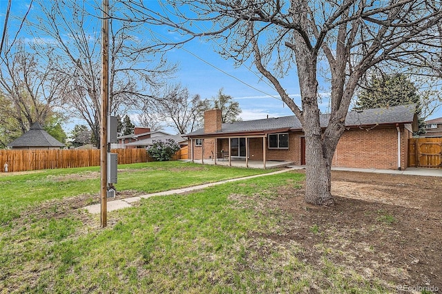 view of yard featuring a fenced backyard and a patio