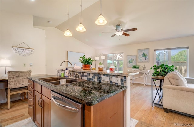 418 Hilltop Cir, Colorado Springs, CO 80905 - kitchen featuring stainless steel dishwasher, vaulted ceiling, light wood-type flooring, healthy amount of natural light, and brown cabinets