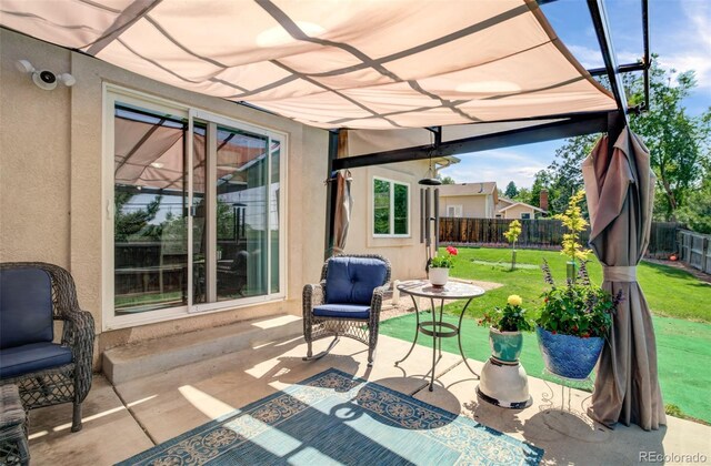 418 Hilltop Cir, Colorado Springs, CO 80905 - fenced backyard with a patio and a pergola