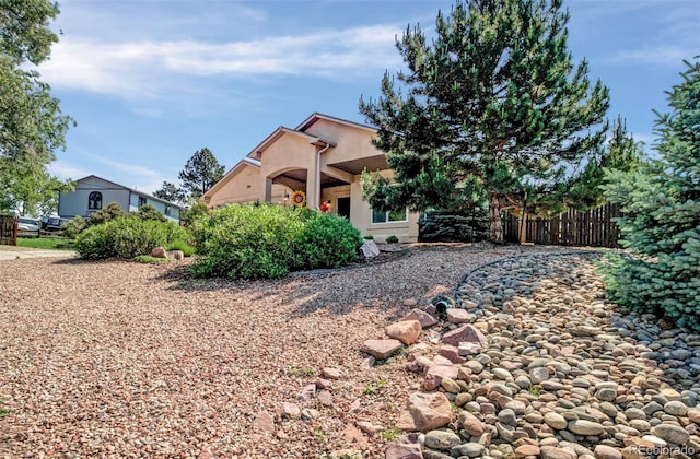 418 Hilltop Cir, Colorado Springs, CO 80905 - back of property featuring stucco siding
