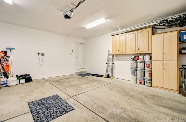 418 Hilltop Cir, Colorado Springs, CO 80905 - garage featuring a garage door opener