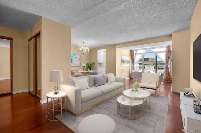 2 Adams St Unit 1507, Denver, CO 80206 - living room featuring a chandelier, wood finished floors, baseboards, and a textured ceiling