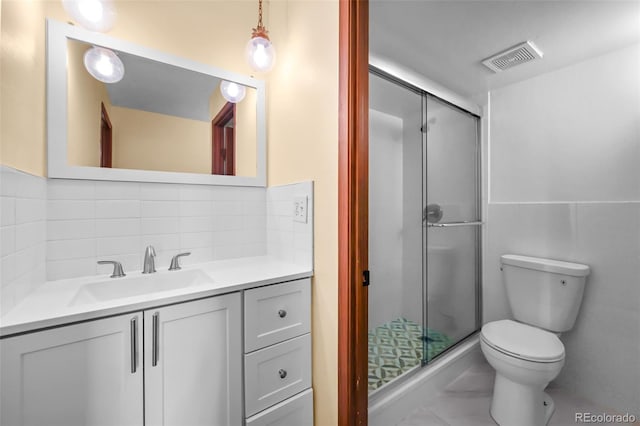 2 Adams St Unit 1507, Denver, CO 80206 - bathroom featuring toilet, a stall shower, vanity, tasteful backsplash, and marble look tile flooring