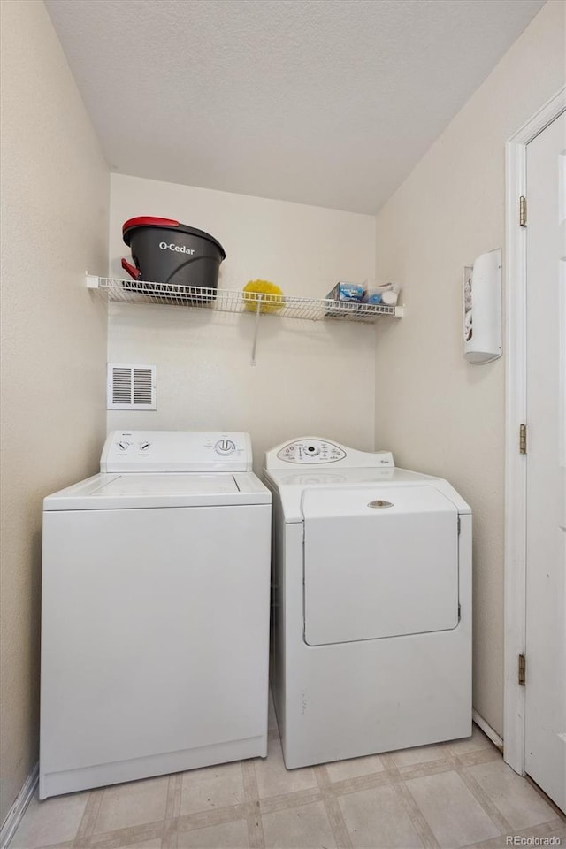 laundry room featuring independent washer and dryer