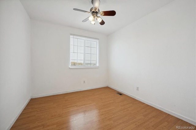 empty room with light hardwood / wood-style floors and ceiling fan