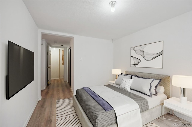 bedroom featuring wood-type flooring