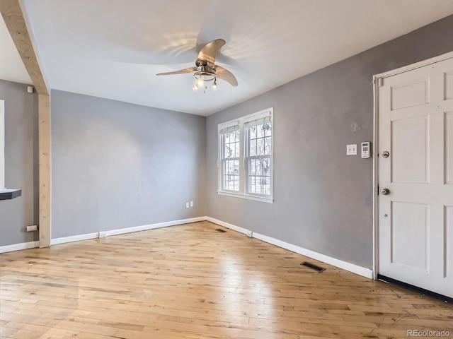 unfurnished room with ceiling fan and light hardwood / wood-style floors